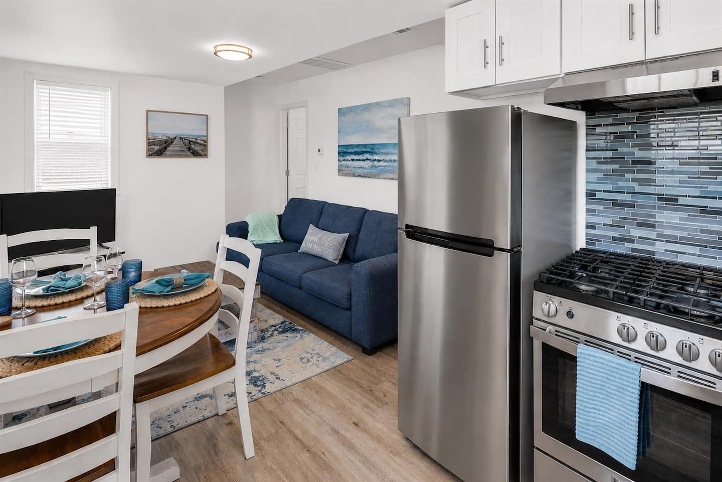 Drop the bags, grab a seat, and pour the first glass of wine. This open kitchen/living/dining room is where you and yours land the second you walk in.