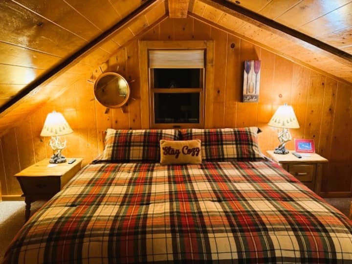 Primary king bedroom with a new Beautyrest hybrid mattress and high quality bedding