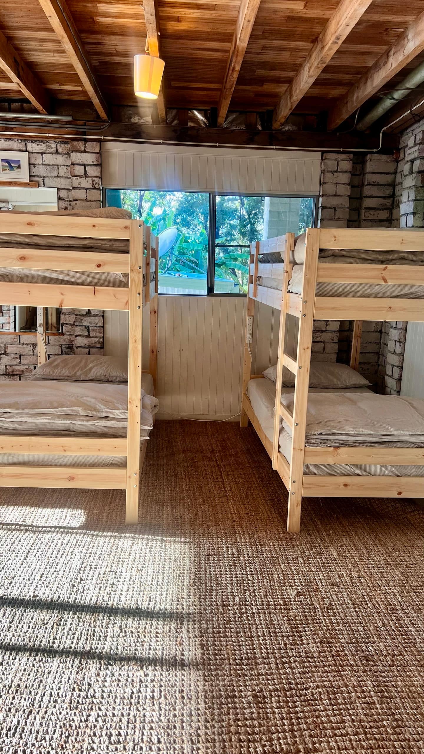 Bunk beds beside a window