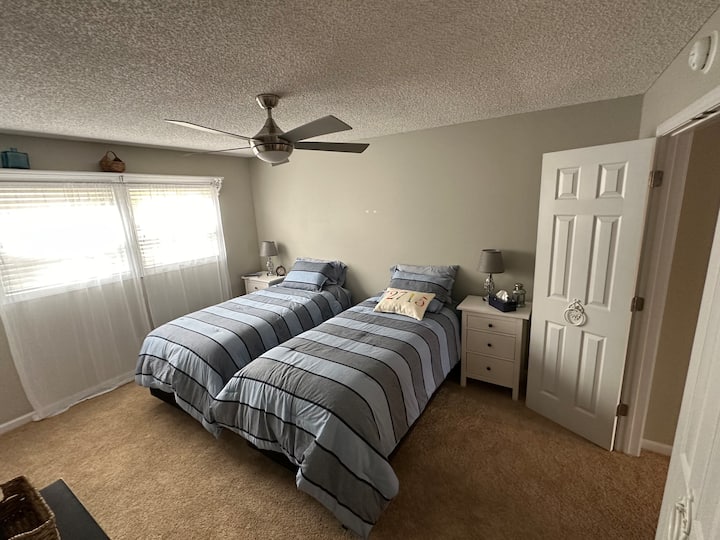 King bed can be split into two extra long twin beds. Bedding for both configurations is provided in closet.