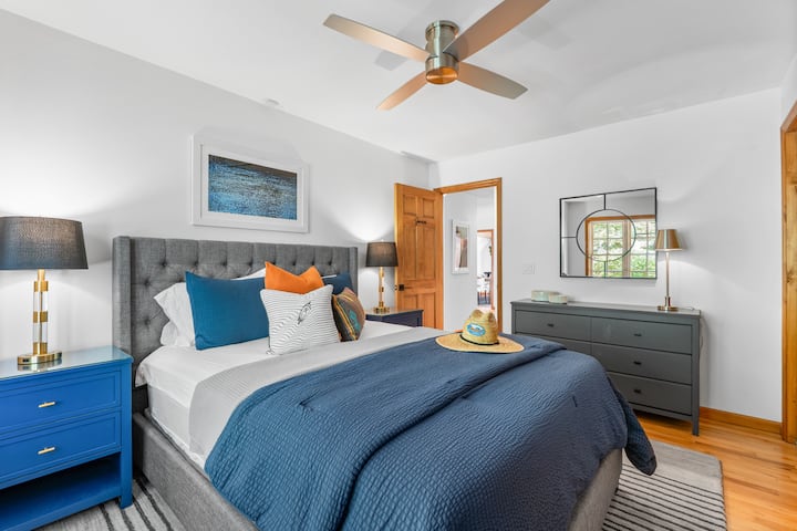 "Summer" Bedroom - Sleeps 2 in a Queen.  Plenty of drawer storage including each of the two guests gets one of two large closets in the room. Ceiling fan w/remote & nightstand with integrated USB and Electric Outlets for easy plug in.