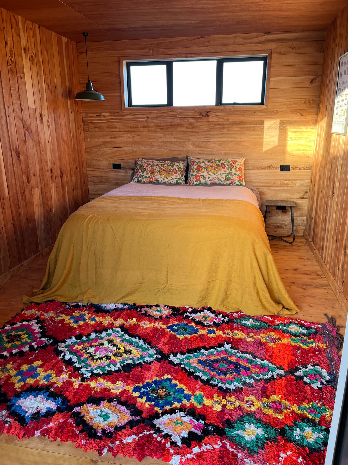 Queen bed at New Chums in Whangapoua