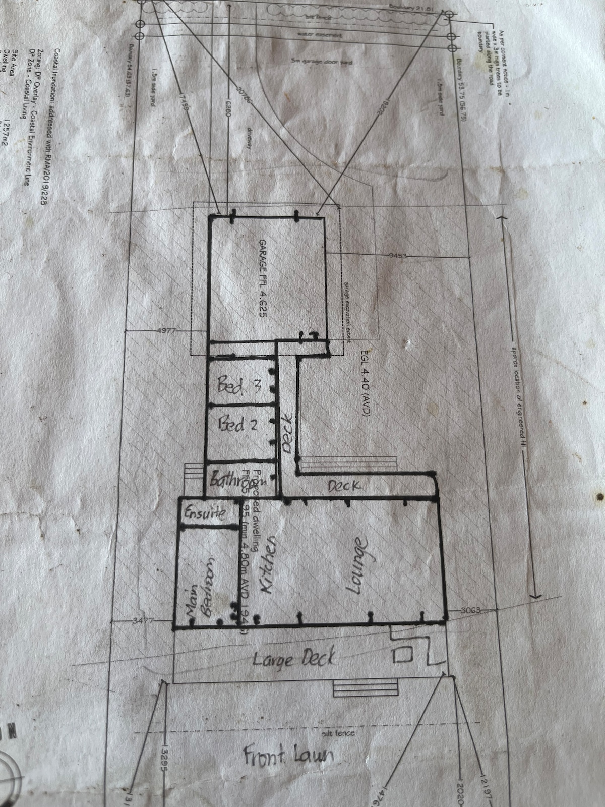 Floor plan. Note the bedrooms 2 & 3 exit onto a covered deck to access the bathroom and kitchen/lounge. at New Chums in Whangapoua