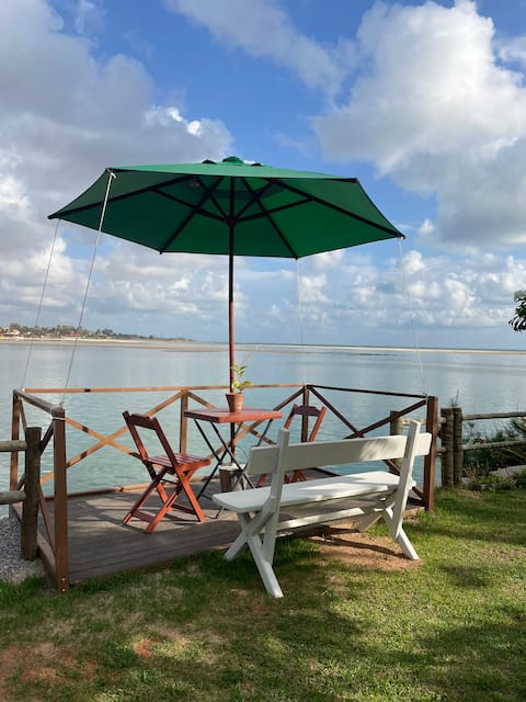 Rustic house between river and sea