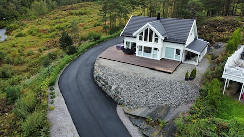 Modern cabin near fjords and mountains