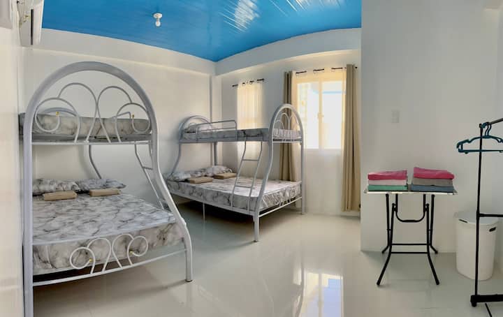 bunk bed with queen sized lower bed and single sized upper bed