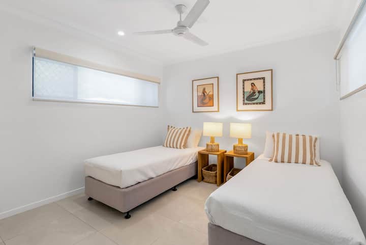 The third bedroom features two single beds, making it an ideal choice for children or friends travelling together.