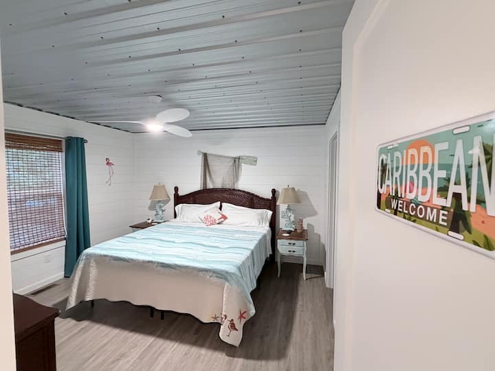 Master Bedroom- The Caribbean Room, on the first floor with a King bed and en-suite bathroom.