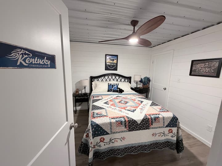 The Kentucky Room with queen bed in basement.