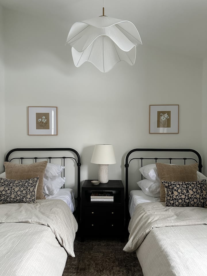 The second bedroom has 2 twin beds, with 2 types of pillows, dresser, mirror and walk in closet. 