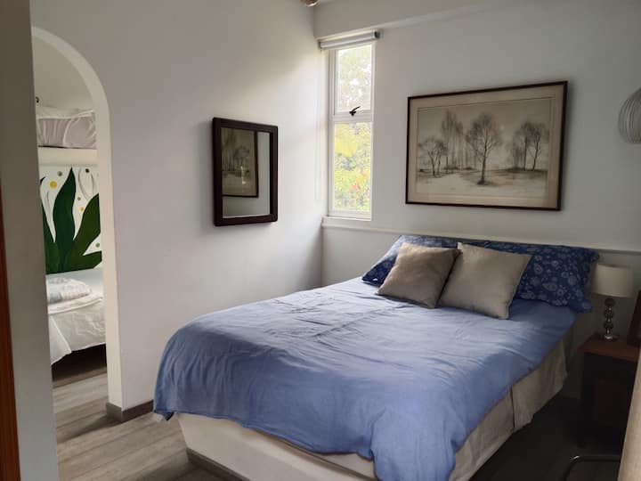 queen size bed and bunk bed, bathroom and balcony