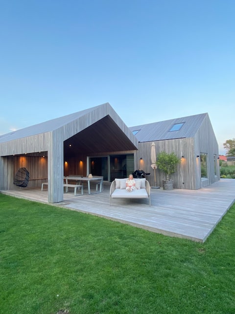 Modern wooden house near city & beach