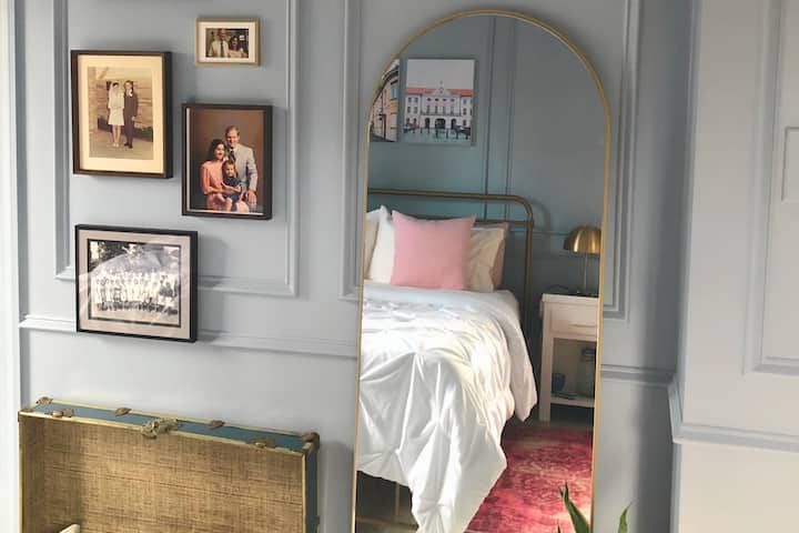 Southwest bedroom suite with queen bed, closet, dressing area, and backyard views. Convenient full bathroom for cooling off in the walk in shower after a sauna session across the hall.