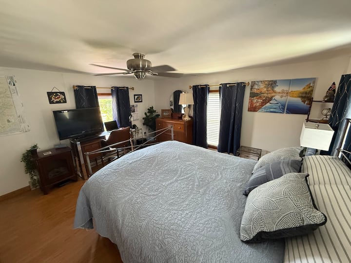 Bed with a view of the Bay and plenty of natural light and darkening curtains. 