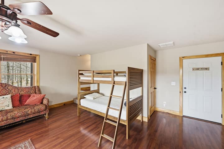 Downstairs has two twin beds and a bunk bed that has two twins.