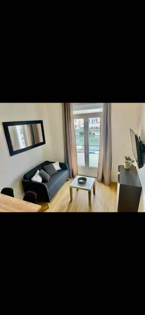 Popular Airbnb listing: Nice new apartment with a prime view of the harbor. in Le Grau Du Roi
