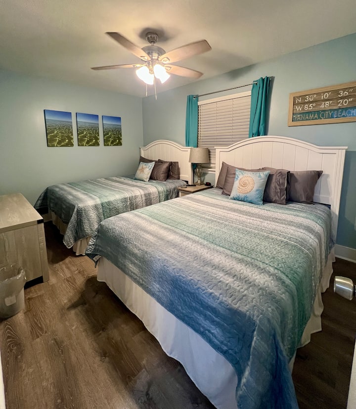 Two Queen beds, large closet with chest of drawers and tv table