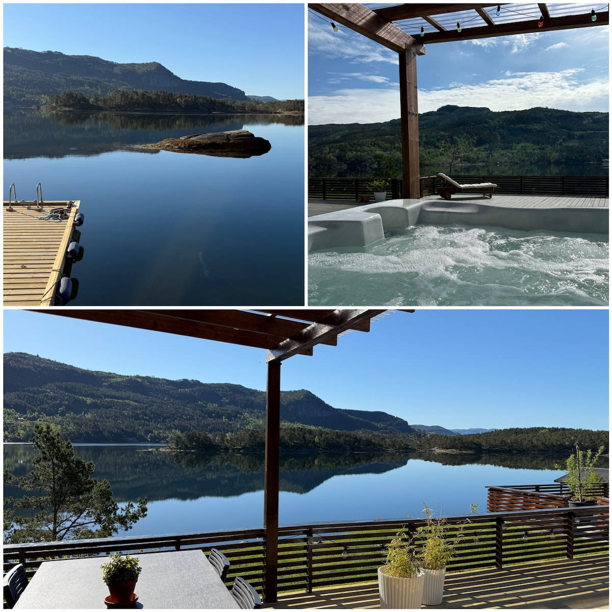 A serene waterfront view captures calm waters reflecting surrounding mountains. The outdoor space includes a hot tub and a spacious terrace, enhancing the overall relaxation experience. Greenery and a dining area contribute to an inviting atmosphere while showcasing the beautiful landscape.