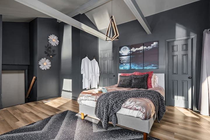 The primary bedroom is a true retreat, featuring a queen bed, private deck with a rocking chair, and a full coffee bar. The ensuite bath includes a soaking tub and oversized shower. Perfect for slow mornings and relaxed evenings.