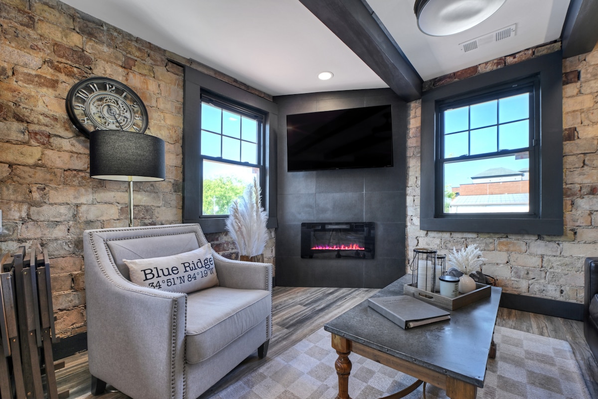 Electric fireplace in the living room provides a warm ambience throughout. 