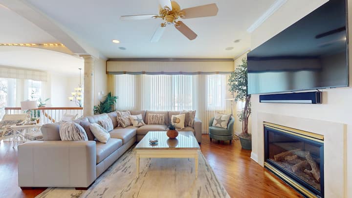 Family room with leather sectional and sofa, gas fireplace and TV. Plenty of seating for your whole group.