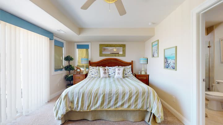 Bedroom 7 on 3rd Floor. King bed with TV, huge walk-in closet, balcony access and ensuite bathroom.