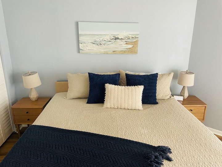 Relax in the spacious master bedroom featuring a comfortable king-sized bed and direct access to the balcony with stunning ocean views. The room also includes a private master bathroom and plenty of storage, creating a serene retreat for your stay.
