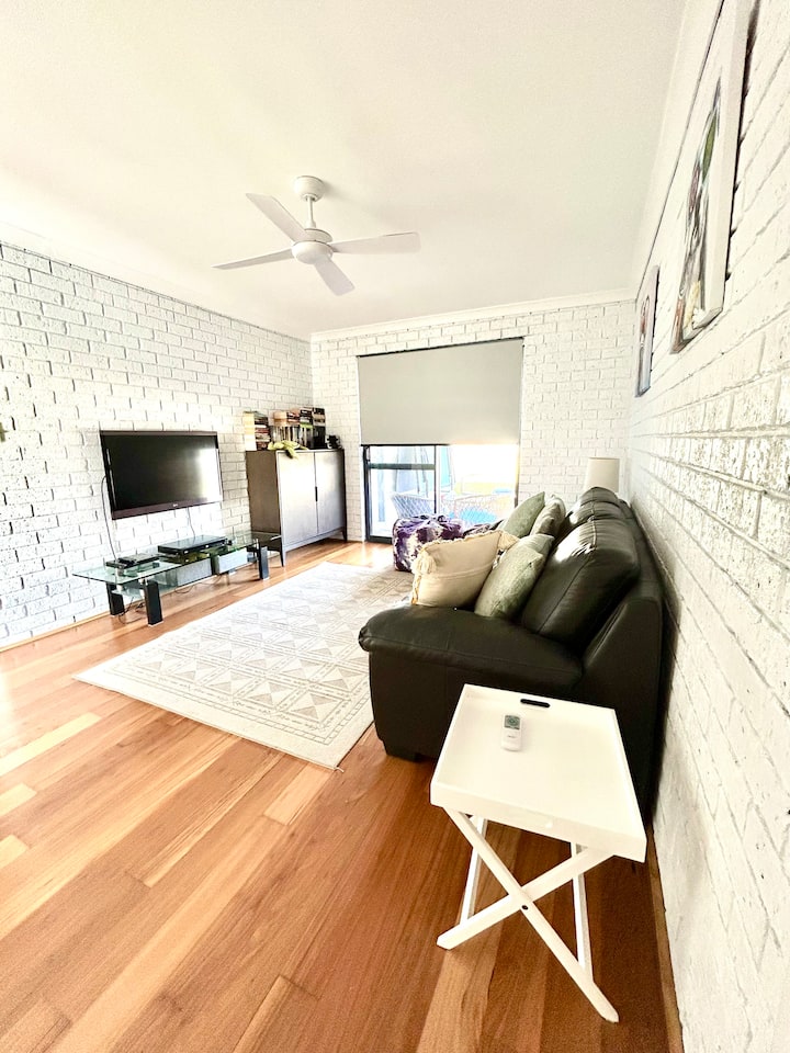 The coastal activity room, designed for fun & relaxation. Whimsical wall art, a 3D TV, books & games keep everyone entertained. Secure garden access & comfortable queen sofa bed is also available, a versatile space ideal for kids & extra guests.