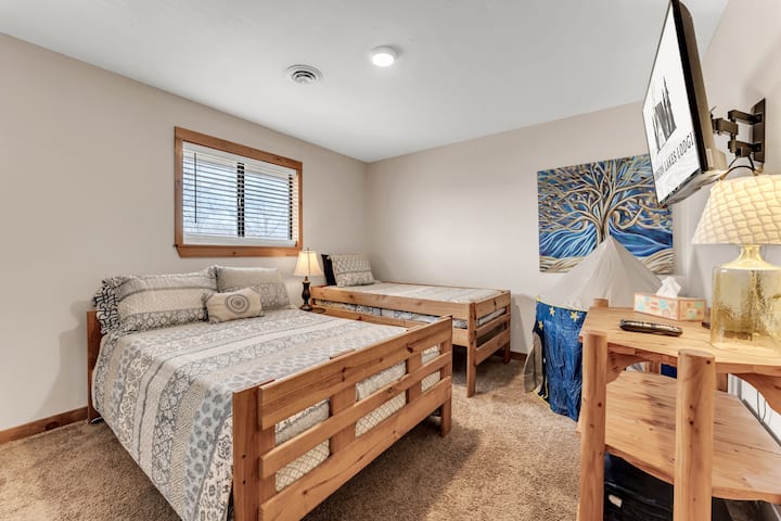 A twin and a full in this fun room complete with tv and kids play tent.