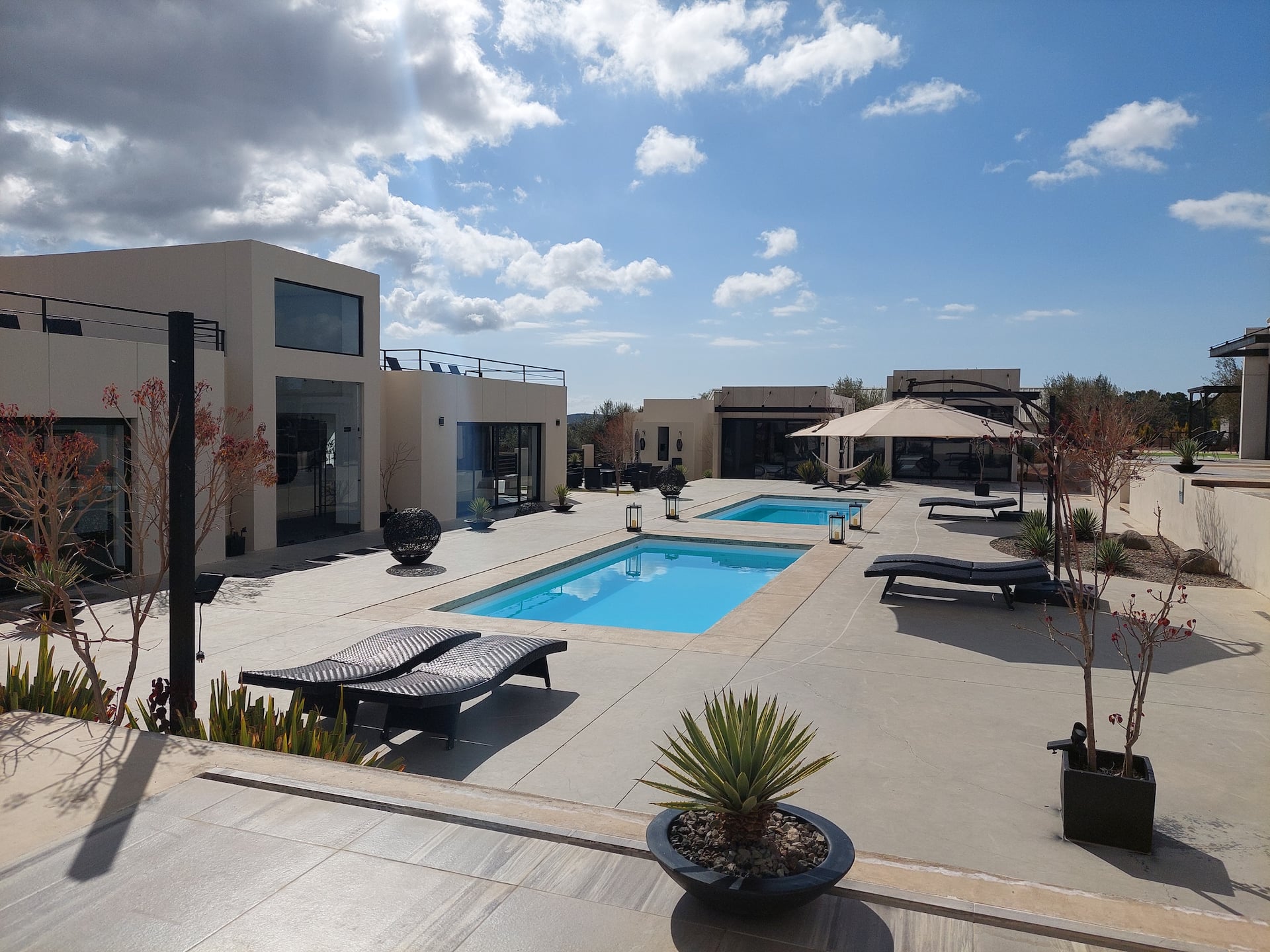 The pool courtyard, with the suites on both sides and the hills behind