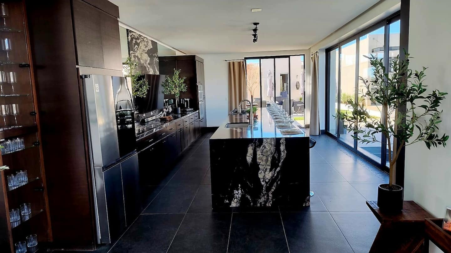 The open kitchen and its sliding glass doors