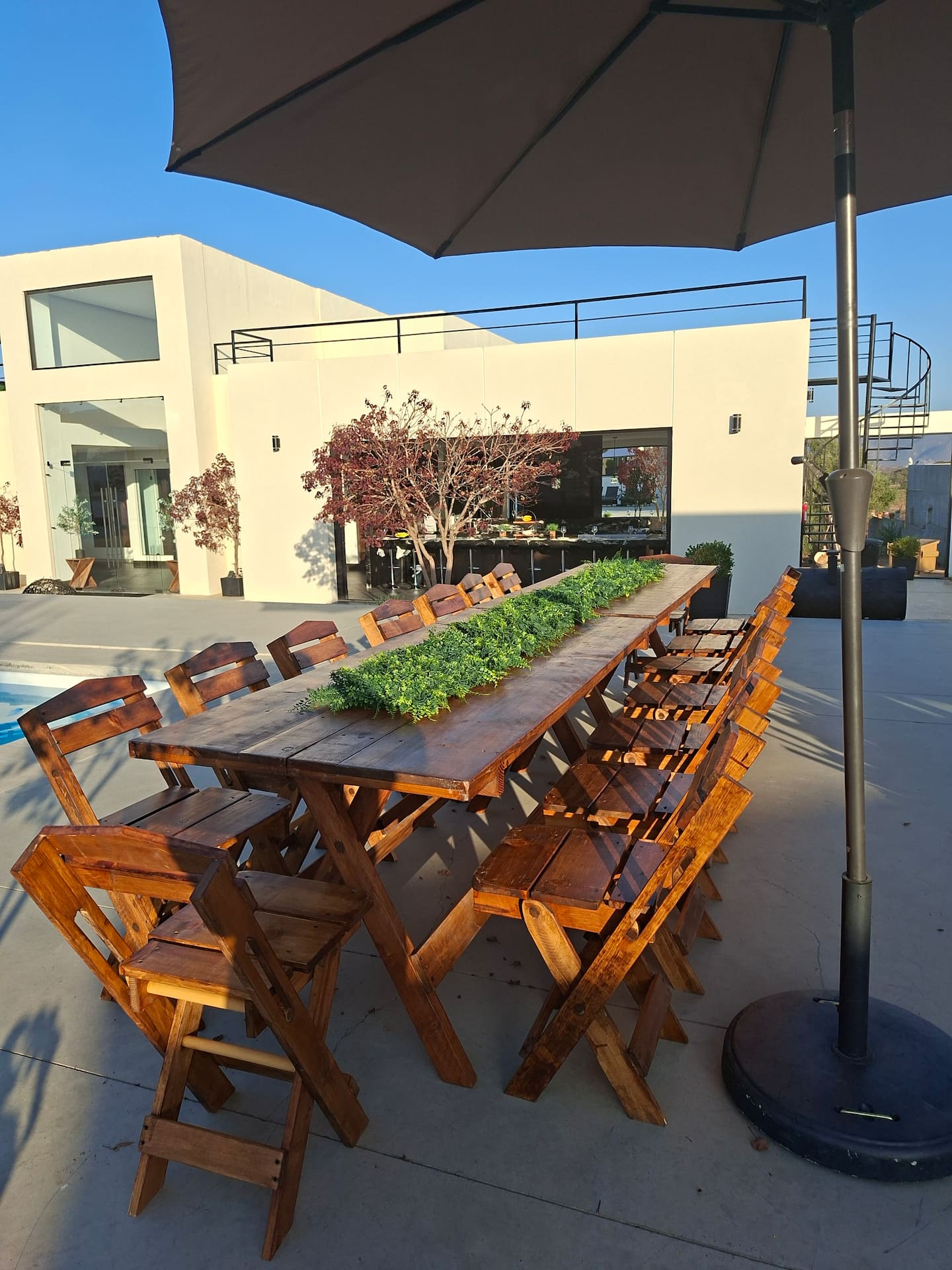 A long table under the umbrellas