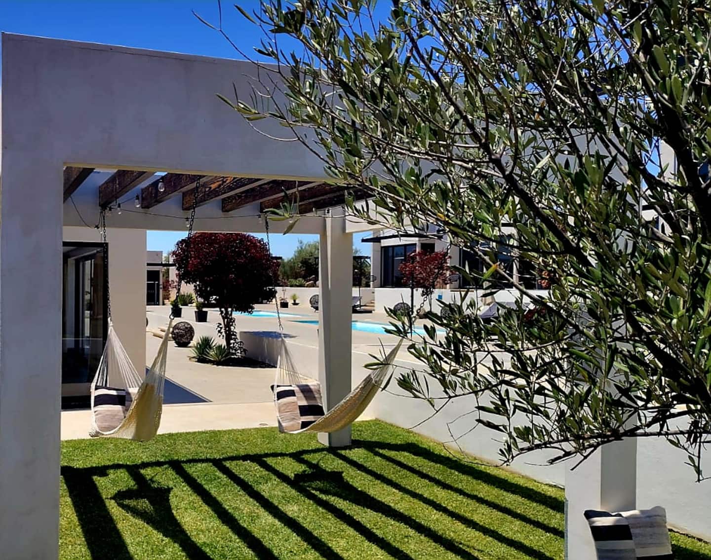Hammocks on the lawn under the pergola