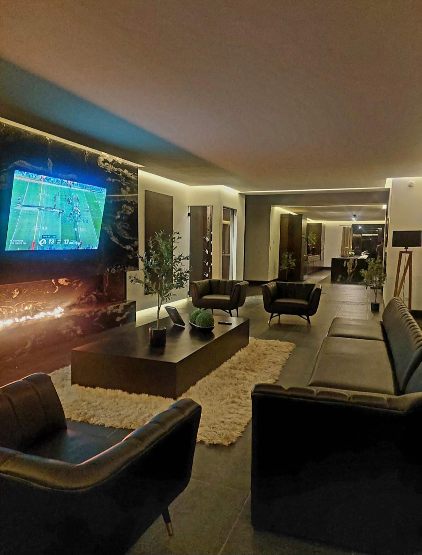 The lounge, with its sofas and television