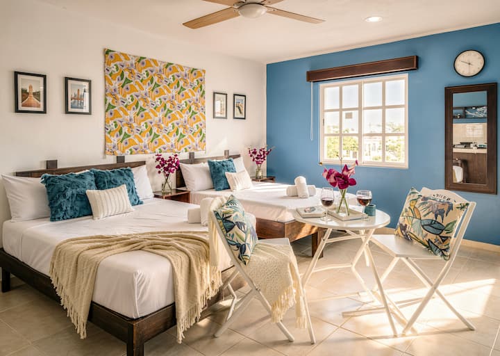 Sink into crisp linens after a day of adventure. The inviting queen bed promises restful nights, while the additional double bed offers flexibility for extra guests, friends, or family without compromising comfort or space.