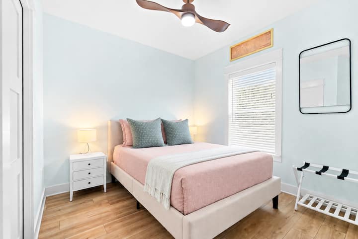 This queen sized bedroom is on thee second level. Enjoy a comfy bed to rest peacefully after a joyous day exploring the nearby beaches and amenities of beautiful Fernandina. A luggage rack and closet is available with drawers for storage.