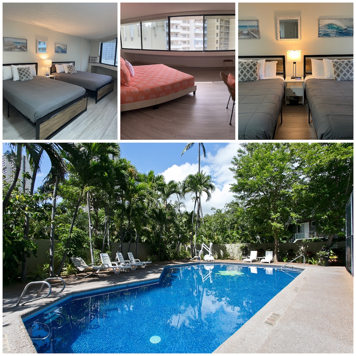 A bright and airy studio features two queen size beds dressed in gray bedding, complemented by soft lighting from a bedside lamp. The large window offers views of lush greenery. A sparkling pool is framed by palm trees, with lounge chairs positioned around its edge.