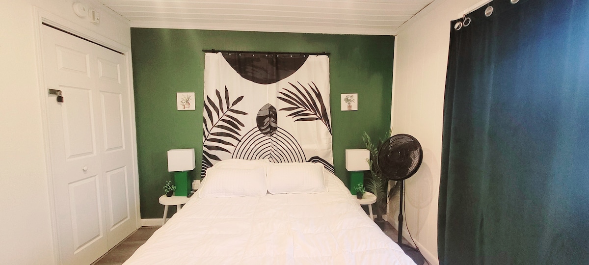 Main bedroom. To the right are the blackout curtains which open to the patio overlooking the bayou. To the left is the owner's supply closet which remains locked and off limits to guests. 