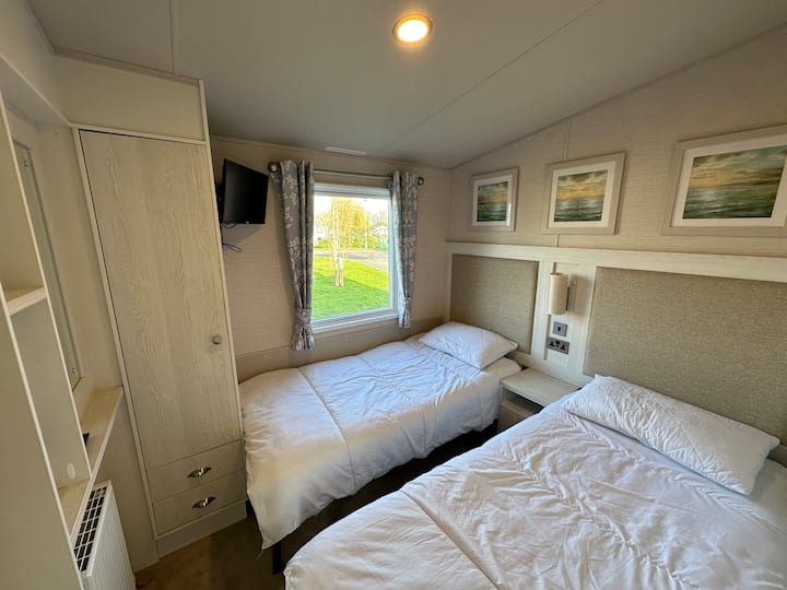 Two full size single beds
HD TV
Wardrobe & Draws