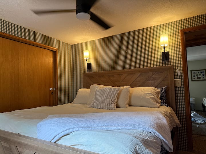 The large bedroom offers a king and a twin memory foam bed. Both are extremely comfortable. There’s a ceiling fan, humidifier and a window fan. While sconces to offer ambience lighting and a large closet to hang your items.