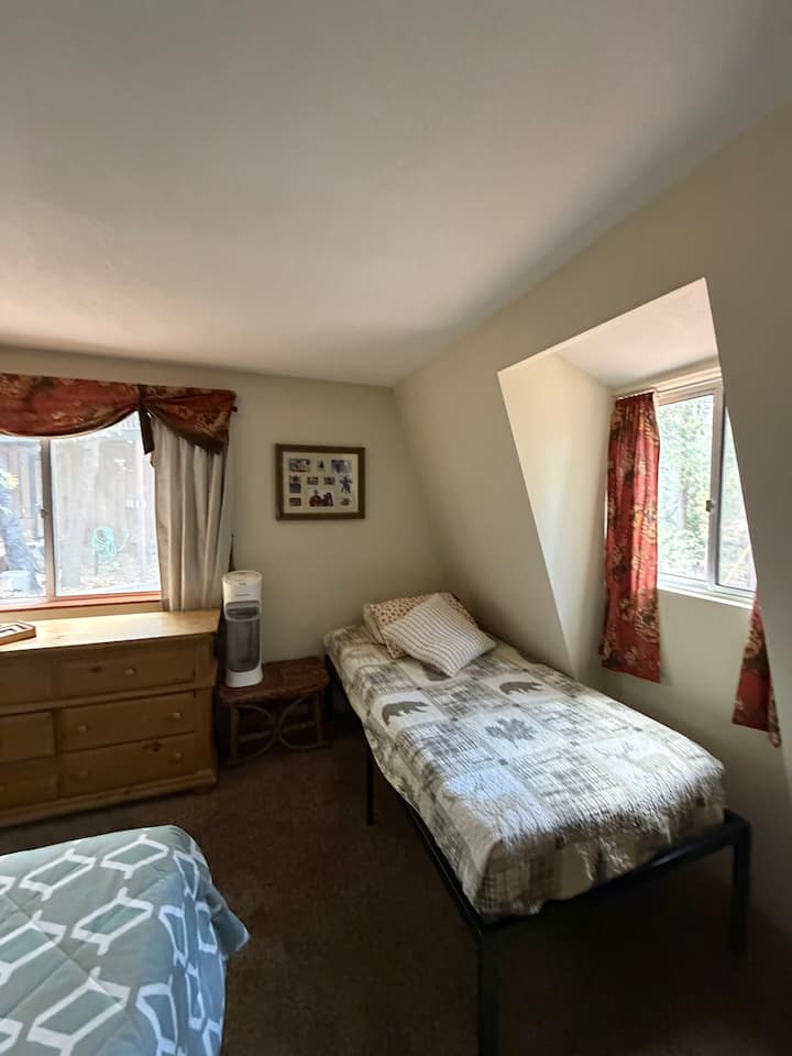 The room offers a king and twin very comfortable memory foam beds. There is a ceiling fan, humidifier, and window fan. Wall sconces, offer ambience lighting. There is a large dresser and closet to hang your items.