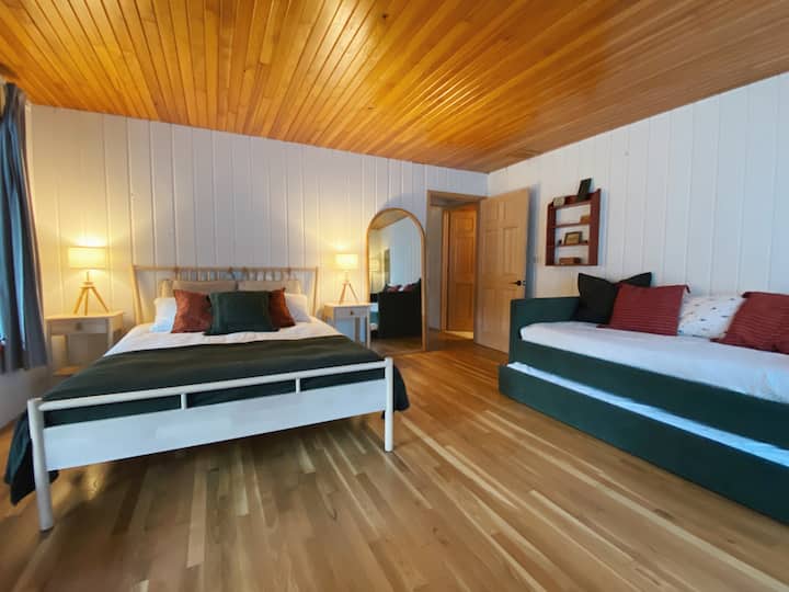 First floor bedroom “Orchard Room’ with Queen bed and a Full sized Daybed with Full sized trundle.