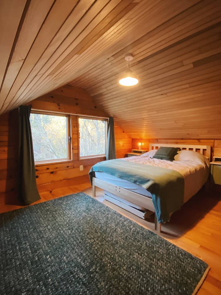 This cozy wood bedroom is a great place to sink in with a good book, and the sound of the rushing creek will lull you into a blissful sleep! 

Trundle under the bed pulls out to reveal a twin mattress.