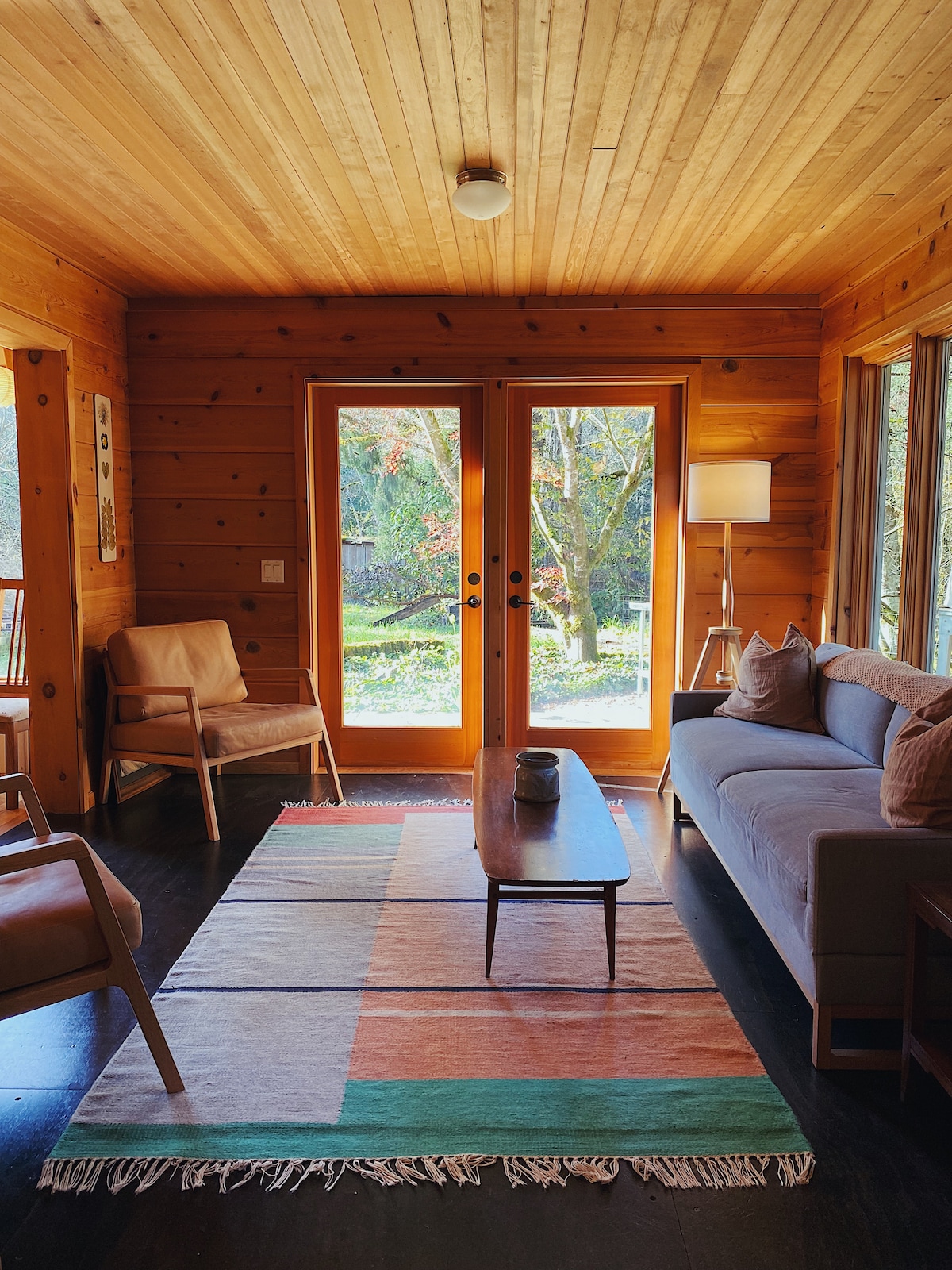 call it a 'snug', a family room, a living room, or a guest room, it's a dreamy place to watch the birds - keep an eye out for eagles hunting in the creek! This Blu Dot sofa folds out into a Queen bed. 