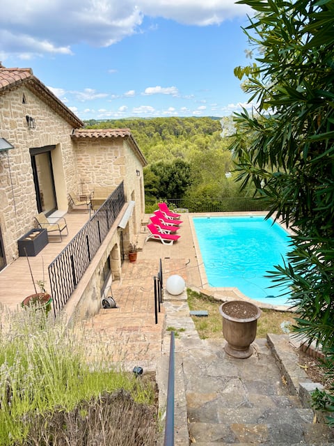 A balcony overlooking the pine forest.