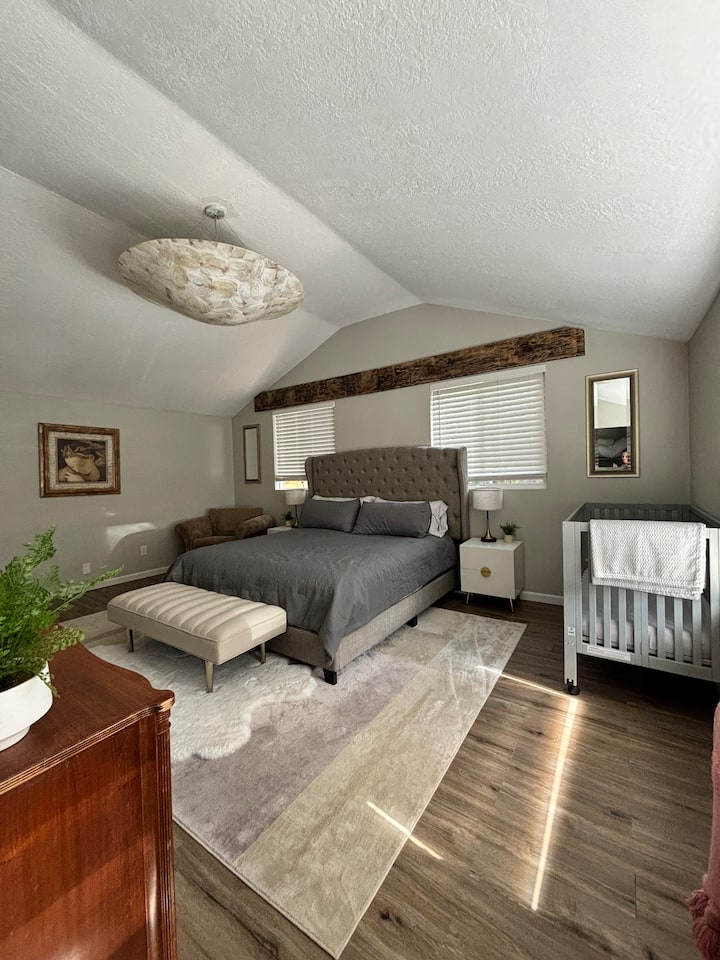 Master bedroom with a crib.