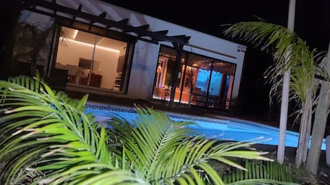 Villa with a private game room, swimming pool, and spa