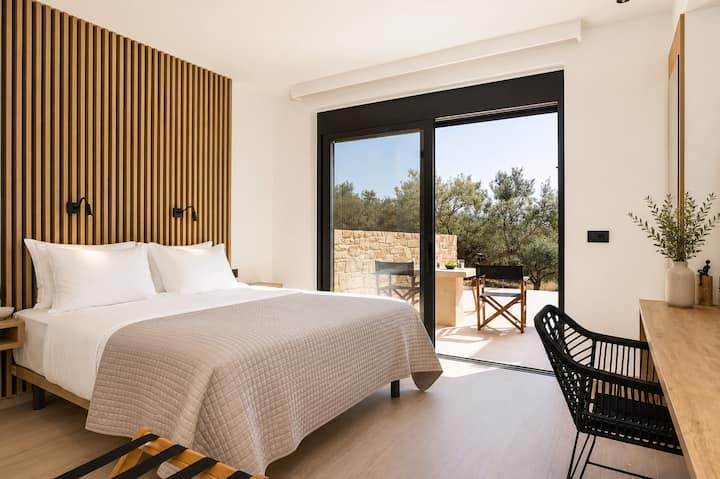 Ground Floor - Bedroom 2 - King-size bed, ensuite bathroom with walk-in shower, and direct access to the pool terrace
