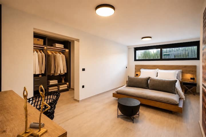 Lower Floor - A stylish private retreat - Bedroom 3 - King-size bed, a sofa-bed, ensuite bathroom with walk-in shower, dressing area, and a peaceful, private atmosphere