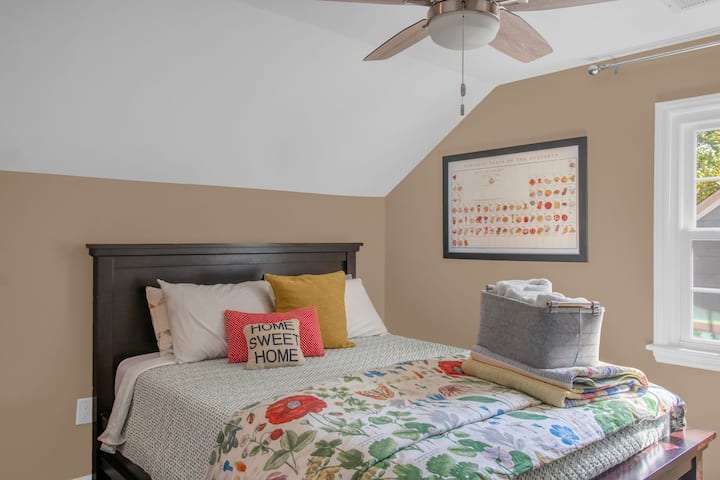 Colorful bedding at Your Mom's Place · private room STR near Downtown Greensboro NC